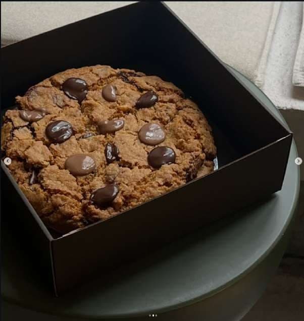 One of the two raw phone photos the catalog started from: a classic New York cookie