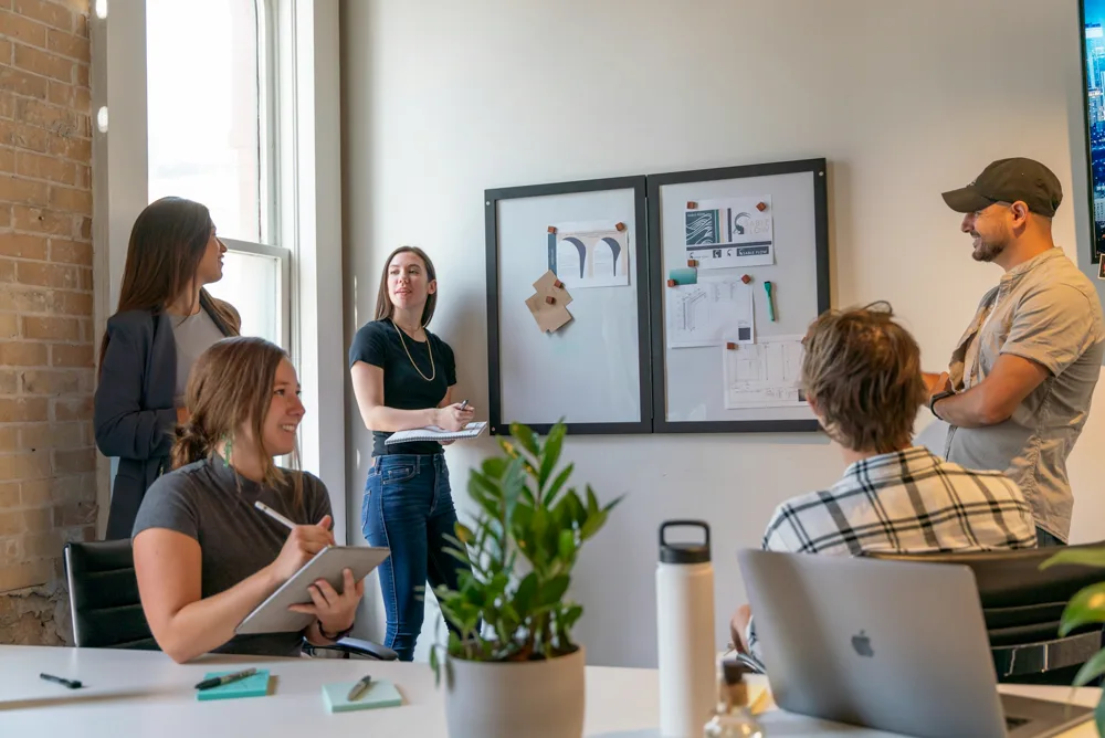 A team talking through a plan in their office